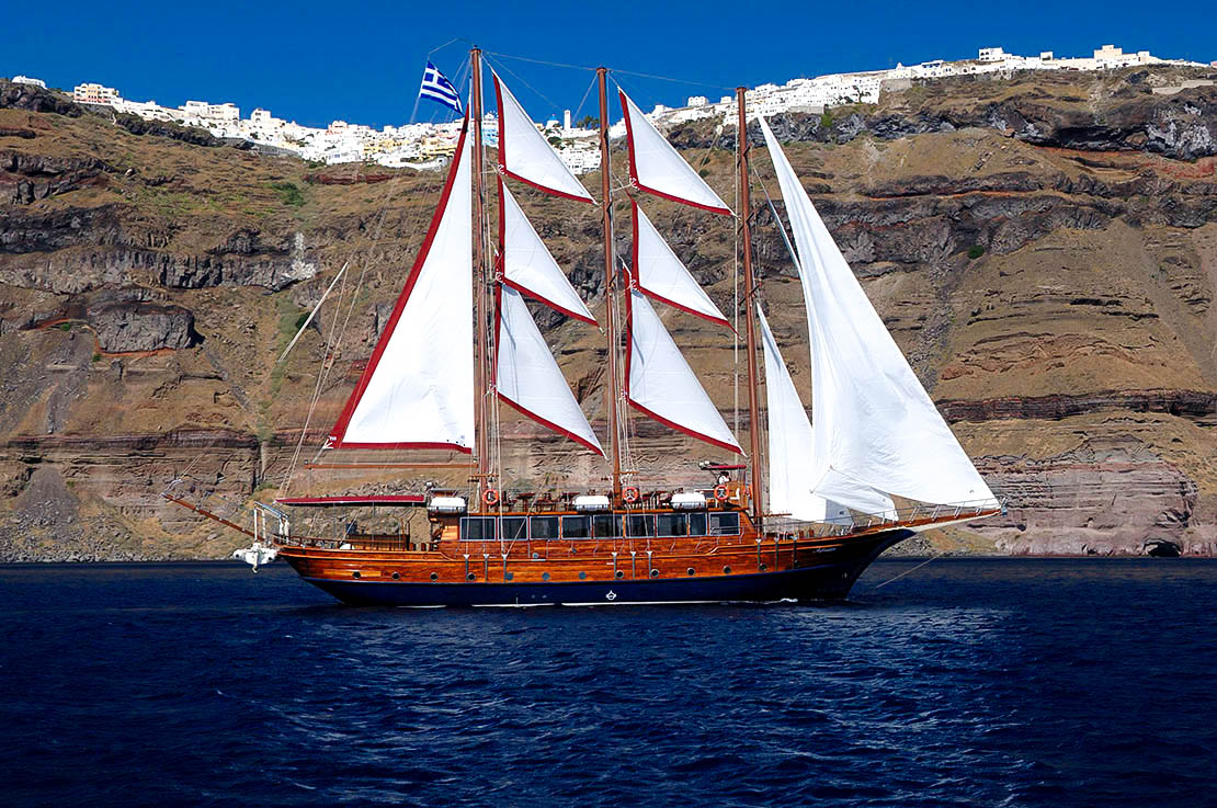 Afrodite wooden vessel sailing inside the Santorini caldera 