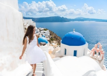 Woman Walking In Oia Santorini Greece